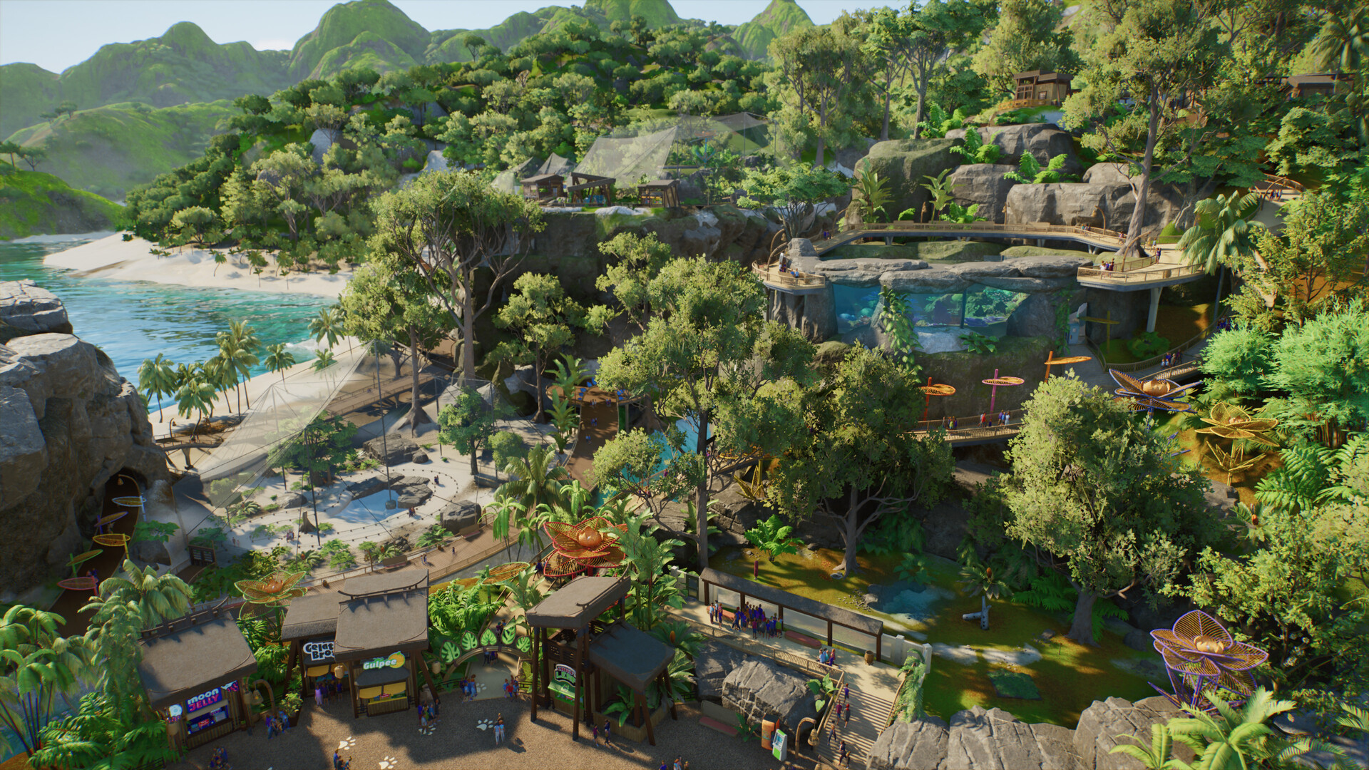 ภาพมุมสูงของสวนสัตว์ริมชายฝั่งที่มีต้นไม้และพื้นที่จัดแสดงสัตว์ใน Planet Zoo 2