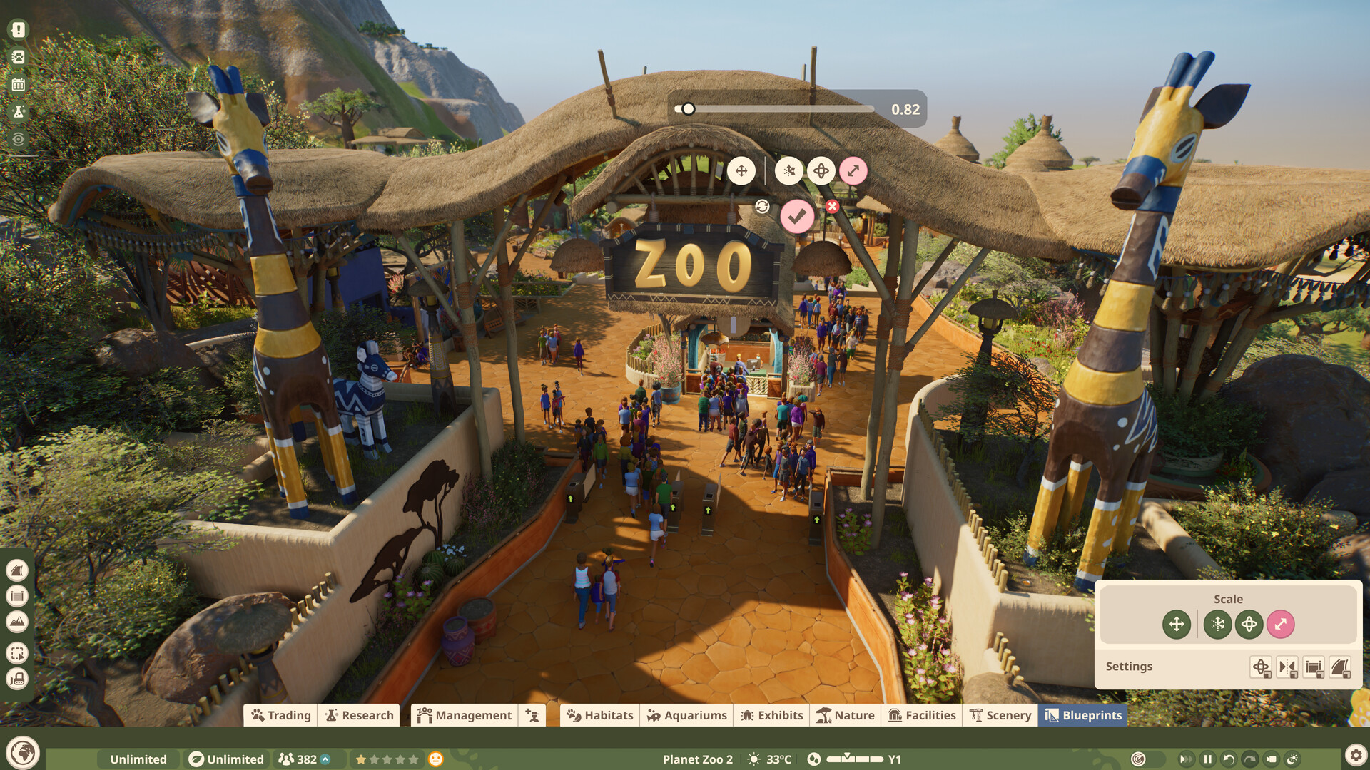 ผู้เข้าชมเดินผ่านซุ้มทางเข้าสวนสัตว์ พร้อมหน้าจอเครื่องมือปรับแต่งใน Planet Zoo 2