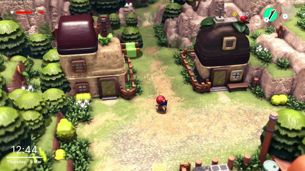 ตัวละครยืนบนทางเดินระหว่างบ้านทรงกลมในหมู่บ้าน Littlelands