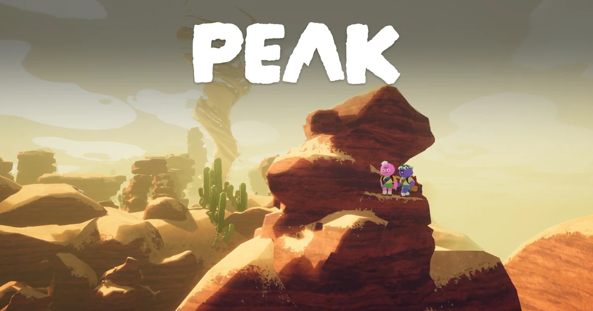 ลูกเสือสองตัวยืนบนโขดหินกลางทะเลทรายใต้โลโก้ PEAK